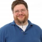 Headshot of Eric McKinney wearing a blue shirt