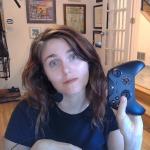 Photo of Taylor holding video game control