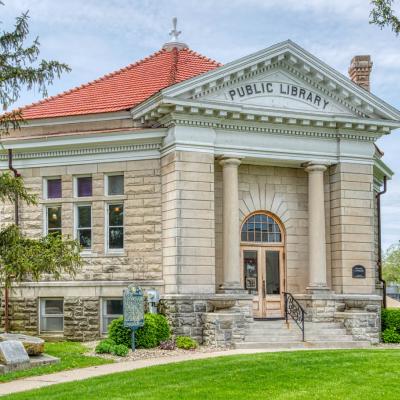 Photo of the Atlanta Public Library District building; an 8-sided, beige limestone building with a red tiled roof.